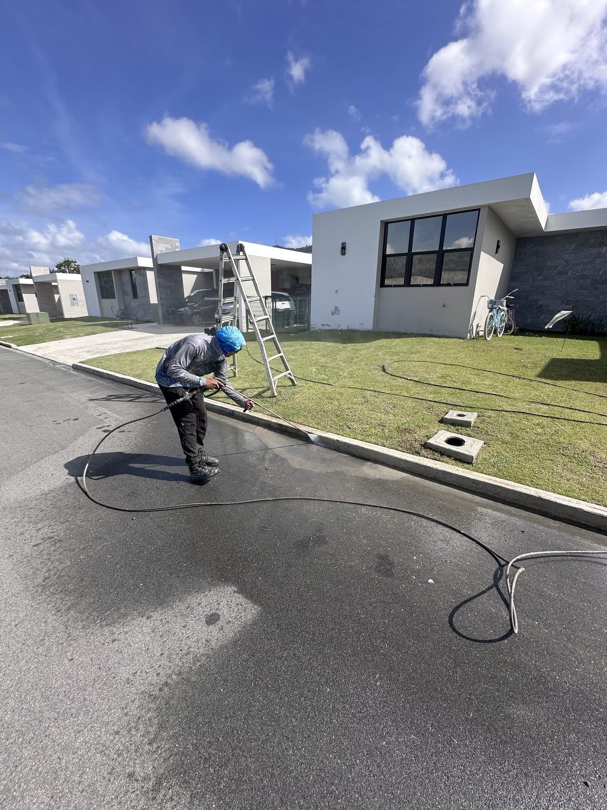 Pressure washing a home's driveway